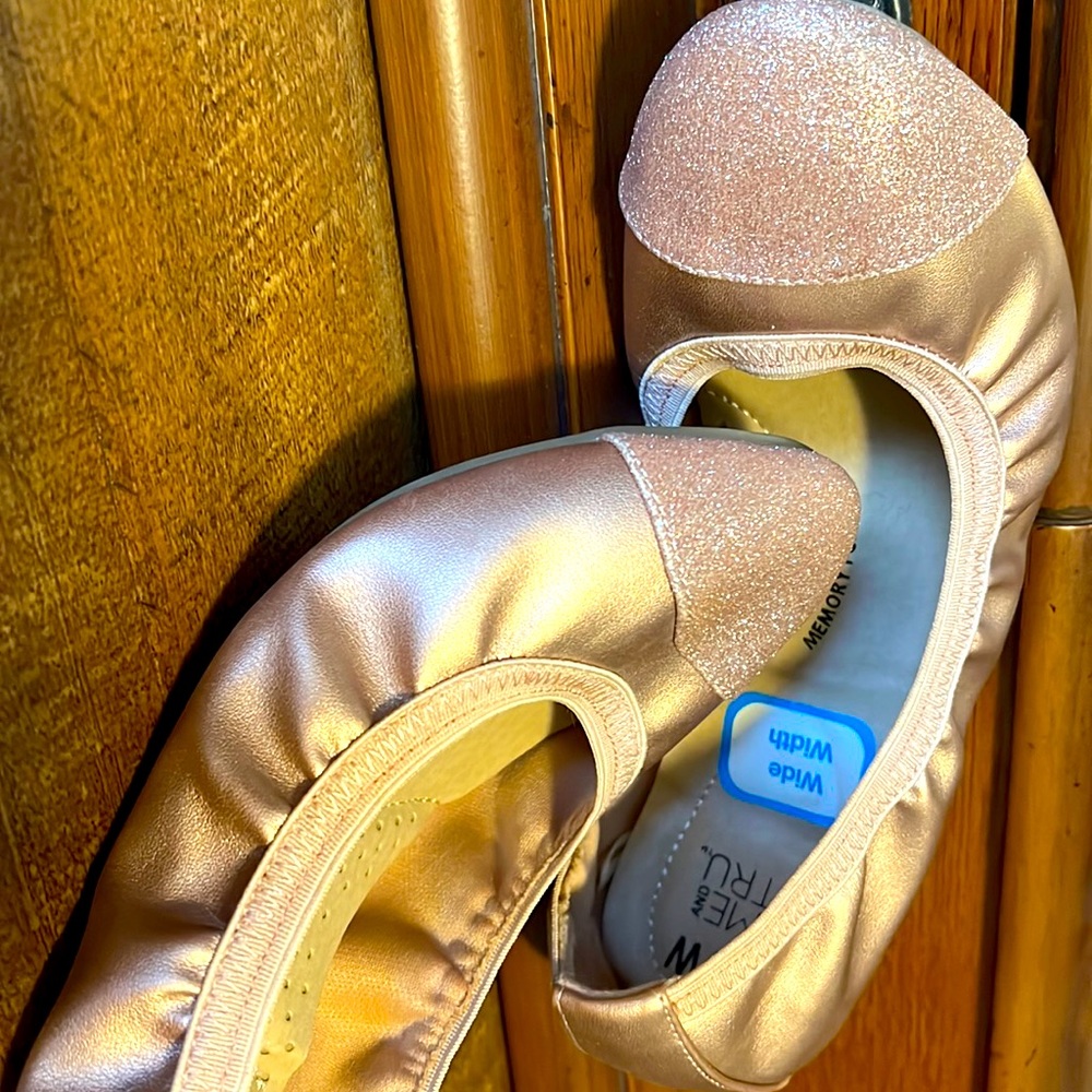 Wide-width, memory foam ballet flats with sparkle toe accent.